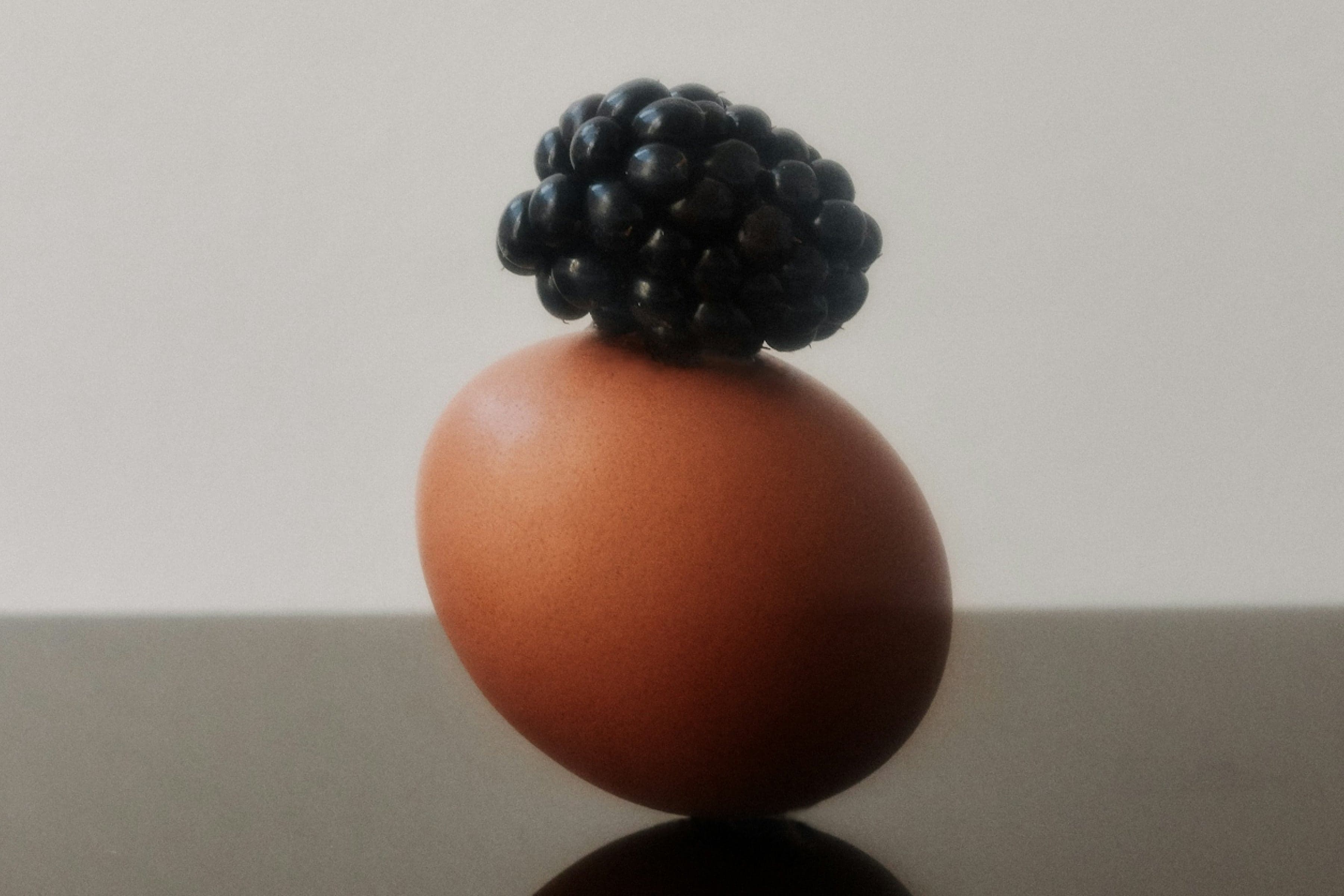 egg with blackberry on top